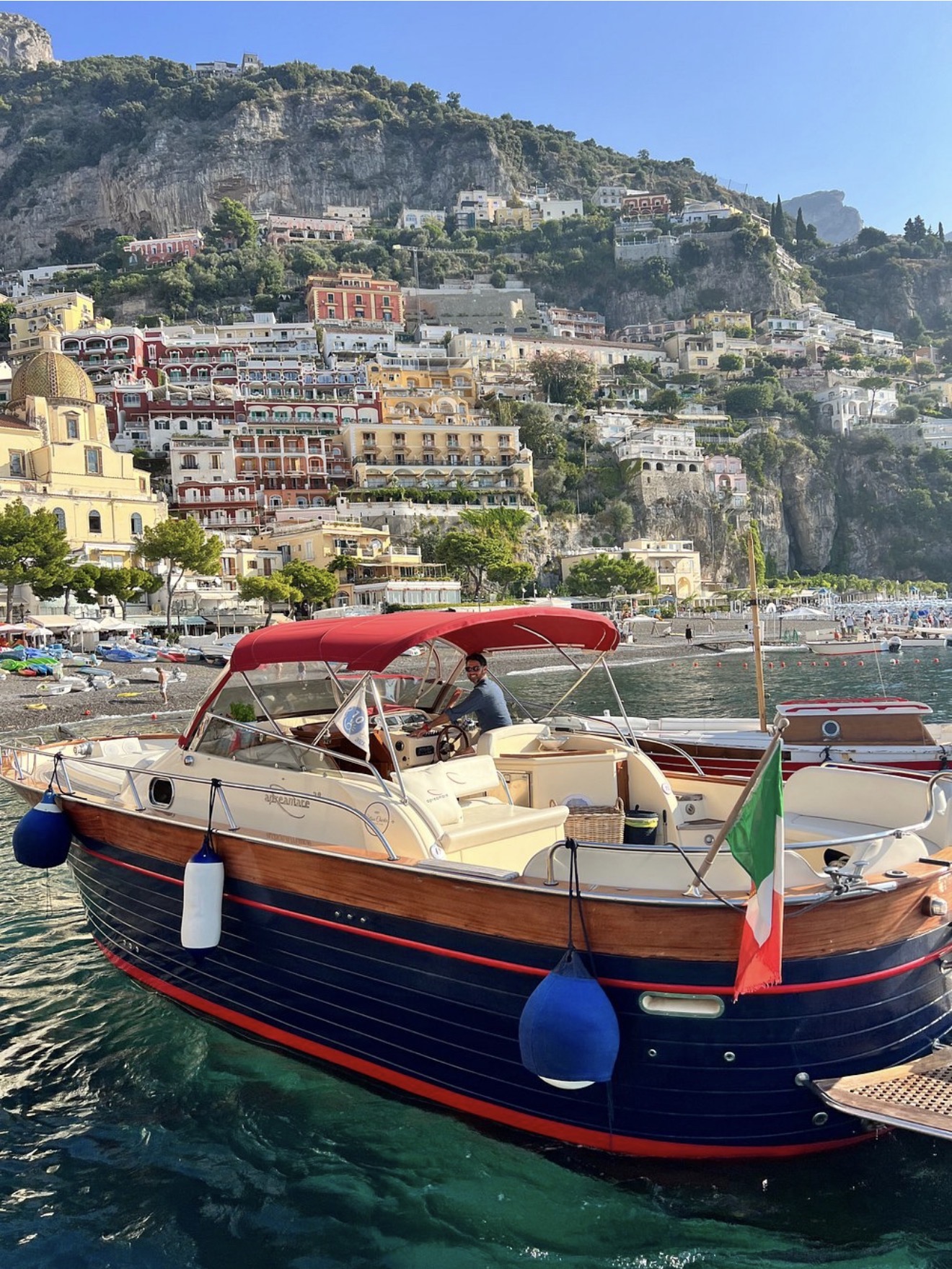 Private boat on the Amalfi Coast with Positano in the background