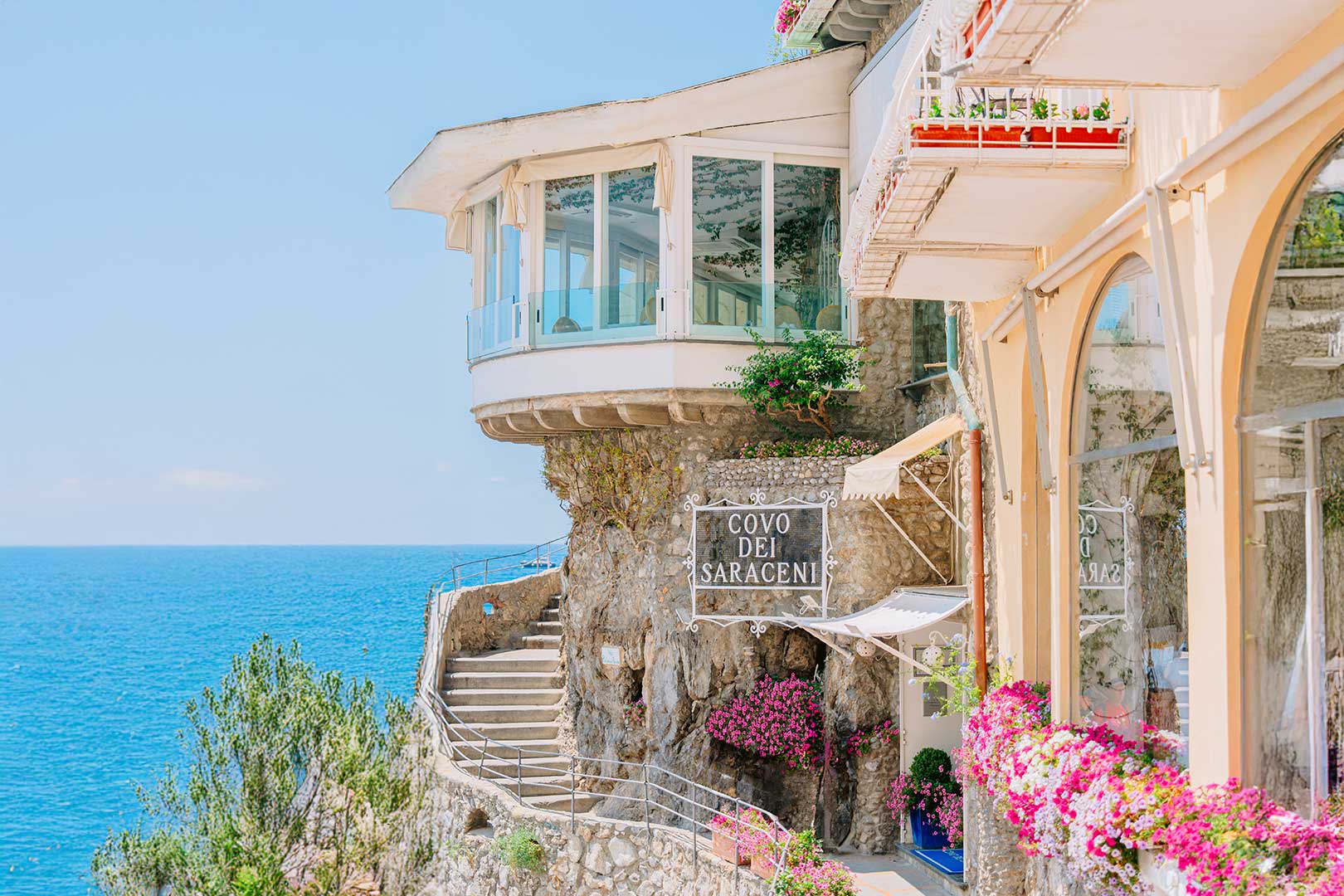 Covo dei Saraceni cliffside exterior with sign