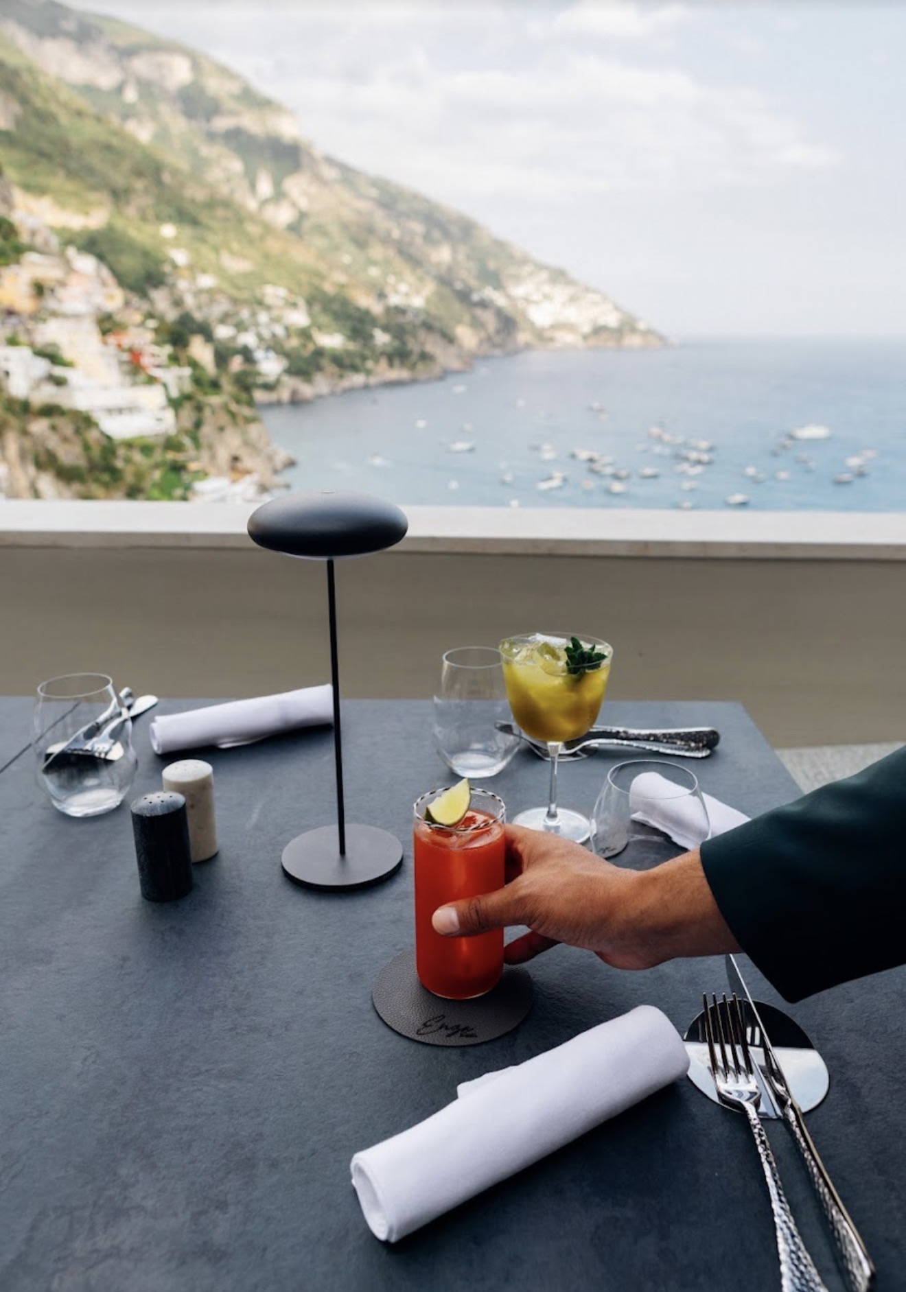 Enza Positano cocktails on table with Positano sea view